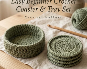 May include: A sage green crochet coaster and tray set with a matching ball of yarn and a wooden crochet hook. The text reads: Easy Beginner Crochet Coaster & Tray Set Crochet Pattern. The items are made of thick yarn.