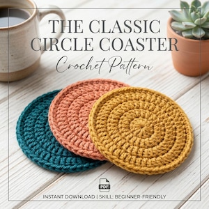 May include: Three circular crochet coasters in teal, terracotta, and mustard yellow. The text reads THE CLASSIC CIRCLE COASTER Crochet Pattern, PDF, INSTANT DOWNLOAD | SKILL: BEGINNER-FRIENDLY. A ceramic mug and a small succulent are visible.