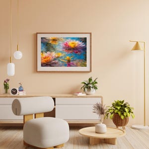 May include: A framed floral painting depicts vibrant water lilies in shades of pink, yellow, and blue. The artwork is displayed in a living room setting with a neutral color palette, complemented by a modern chair, wooden furniture, and decorative plants.