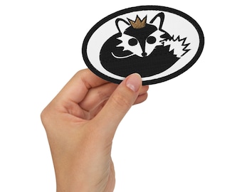 Fox Prince geborduurde opstrijkpatch: zwarte en gouden ovale appliqué