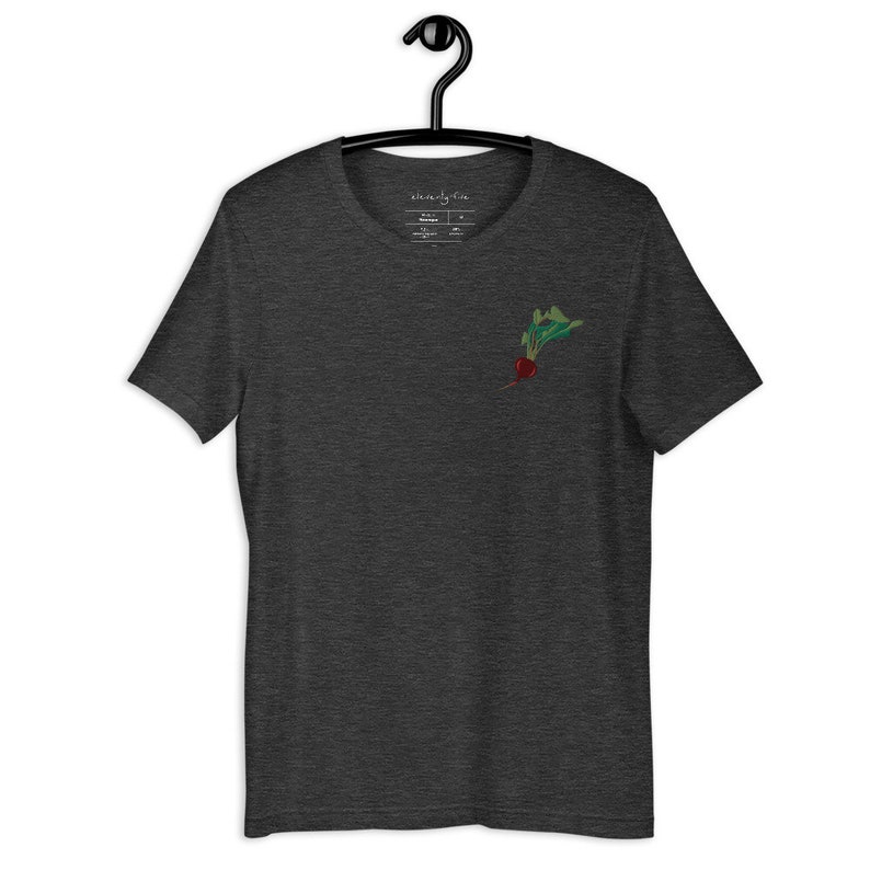 May include: Dark heather grey t-shirt with a small embroidered image of a red beet with green leaves.
