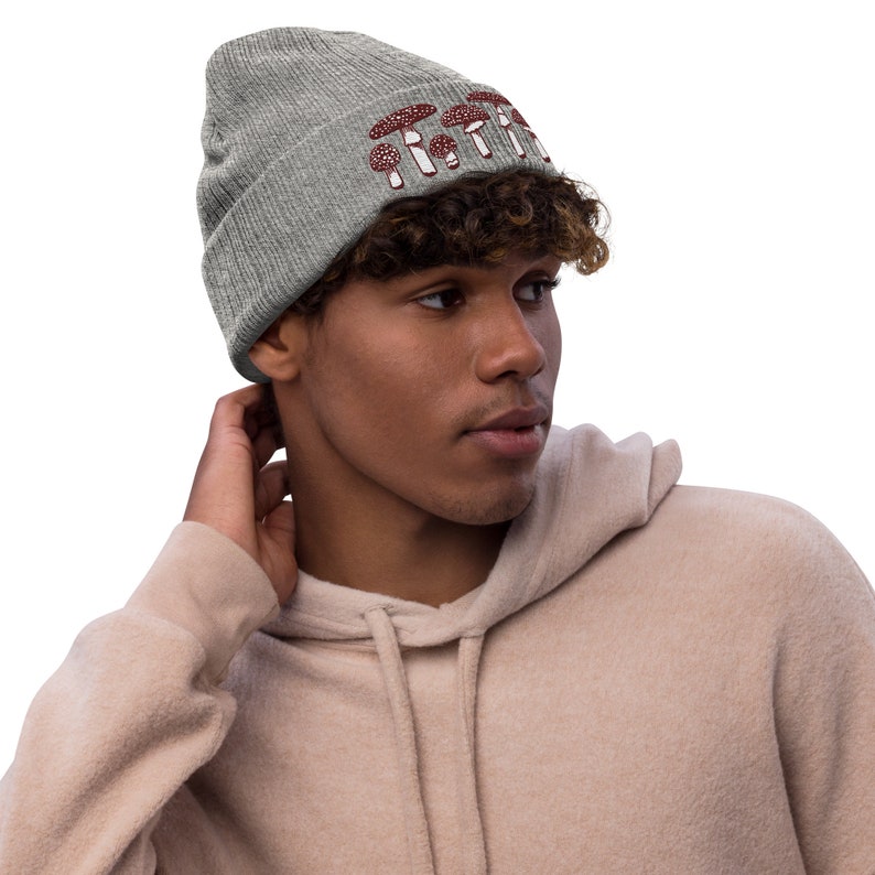 May include: A gray beanie with a red mushroom graphic and the text "Shroom Queens".