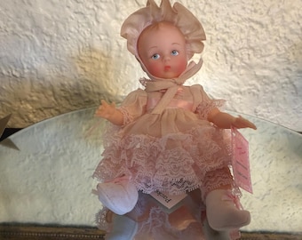 Madame Alexander "Little Genius" doll (specifically model #701), originally released in the 1990s