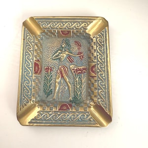 1900s solid brass ashtray, city of Knossos, Crete in Greece, souvenir has figural design from a fresco there known as Prince of the Lilies