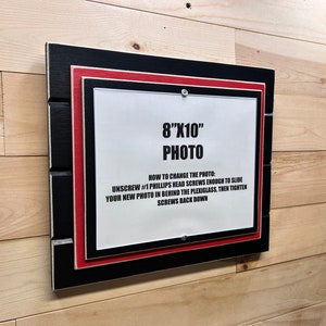 Black and red picture frame holds 8x10 International colors