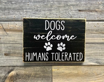 Dogs welcome humans tolerated / sign / wall quote