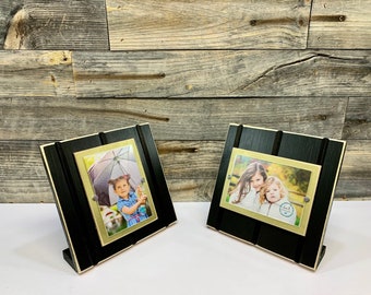 Black and old gold table top picture frame holds one 4"x 6" photo. New Orleans Saints