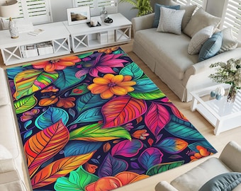 May include: A rectangular area rug with a vibrant floral design. The rug features large, colorful leaves and flowers in shades of orange, pink, blue, and green against a dark background. The rug is placed in a living room setting.