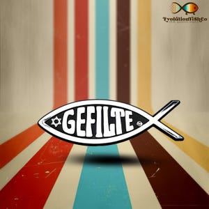 May include: A white fish-shaped symbol with the word "GEFILTE" written in black letters. The symbol also includes a Star of David. The symbol is on a background of colorful vertical stripes.