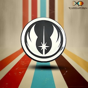 May include: A black and white circular sticker with the Jedi Order symbol. The symbol features a lightsaber, a star, and two wings.