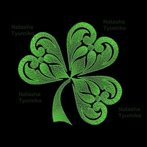May include: Green embroidered shamrock design with the text "Natasha Tyumiko" repeated around the image. The text "Tyumiko 8 sizes" appears at the top of the image.