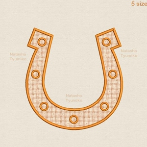 May include: An embroidered horseshoe design in shades of orange and tan. The horseshoe has a detailed plaid pattern within its outline and is accented with circular details. The text "Tyumiko 5 sizes" is visible in the upper right corner.