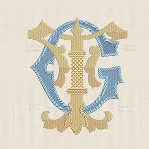 May include: A monogram embroidery design featuring the letters "TG" in a traditional script font. The letters are in a blue and gold color scheme, with the "T" on top of the "G". The design is surrounded by decorative flourishes.