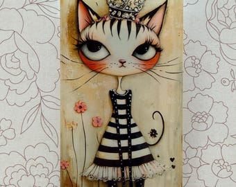 May include: A rectangular artwork featuring a stylized cat wearing a crown and a black and white striped dress. The cat has large eyes, long eyelashes, and whiskers. Pink flowers and black hearts are also depicted.