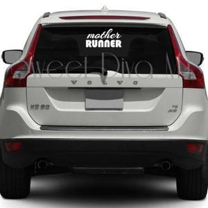 May include: White Volvo XC60 with a white vinyl decal on the rear window that says "mother runner".