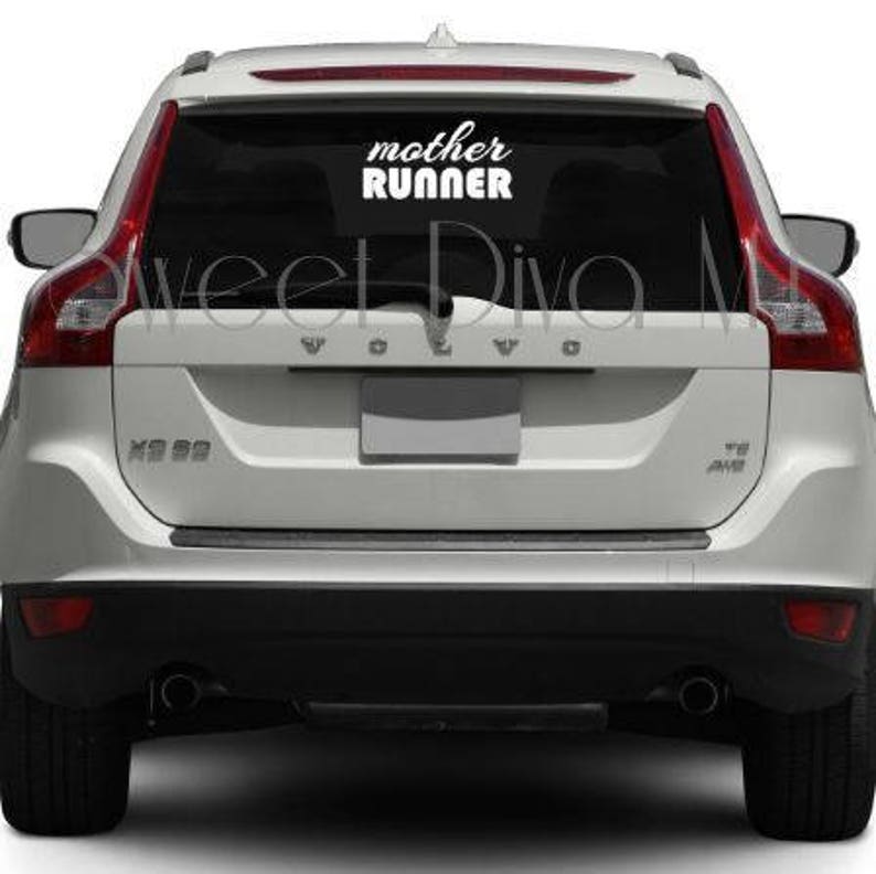 May include: White Volvo XC60 with a white vinyl decal on the rear window that says "mother runner".