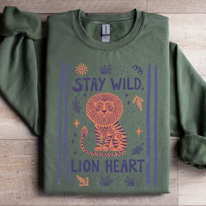 Stay Wild Lion Shirt, Inspirational Animal Graphic Tee, Unique Lion Heart Design, Green Sweatshirt, Cozy Fall Apparel, Motivational Top
