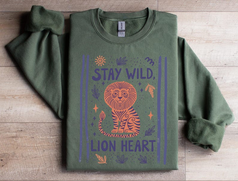 Stay Wild Lion Shirt, Inspirational Animal Graphic Tee, Unique Lion Heart Design, Green Sweatshirt, Cozy Fall Apparel, Motivational Top