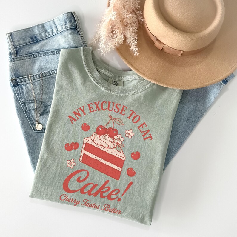 a pair of jeans and a t - shirt with a cake on it