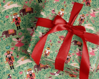 May include: Wrapped gifts with green wrapping paper decorated with nutcrackers, fairies, elephants, and rabbits. The gifts are tied with a bright red satin ribbon and bow. The wrapping paper is ideal for Christmas or birthday presents.