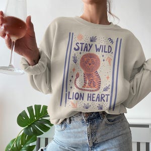 Stay Wild Lion Heart Sweatshirt, Cozy Graphic Sweatshirt, Motivational Lion Shirt, Inspirational Animal Lover Gift, Cute Casual Wear