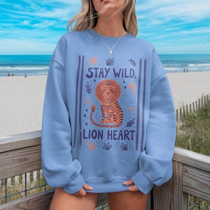 Stay Wild Lion Heart Sweatshirt, Cute Lion Graphic Pullover, Blue Sweatshirt, Inspirational Animal Sweatshirt, Beachwear Outfit