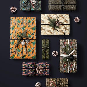 a collection of nine wrapped gifts with various patterns and colors, arranged on a dark background.