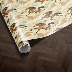 a roll of wrapping paper with a repeating pattern of brown horses on a beige background.