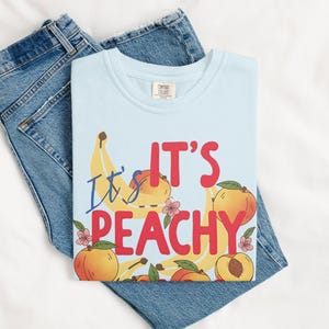It's Peachy Graphic T Shirt, Fun Fruit Print Shirt, Cute Casual Tee, Summer Graphic Tee, Trendy Peach and Banana Design Shirt