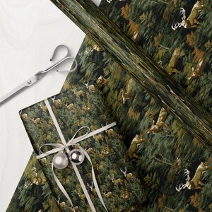 a gift wrapped in a patterned wrapping paper with a deer design, along with a pair of scissors and a piece of paper with a similar deer pattern.