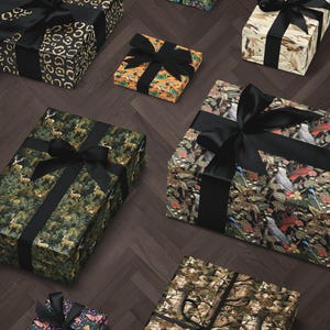 a collection of various gift boxes with different patterns and colors, including camouflage, floral, and abstract designs.