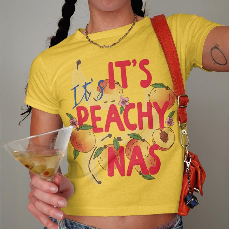 It's Peachy Graphic T-Shirt, Cute Fruit Shirt, Funny Summer Tee, Peach Lover Gift, Women’s Casual Top, Trendy Yellow Shirt