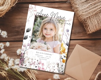 May include: A birthday invitation featuring a young girl's photo, with the text "Anne Marie Turns Four." The invitation has a floral design in shades of pink, purple, and yellow. A brown envelope is next to the invitation.
