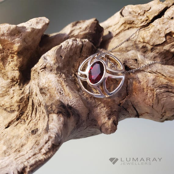Pendant out of 925 silver is set with a Mozambique garnet and is all hand made.  It comes with a 925 Sterling Silver 45cm chain. Great gift