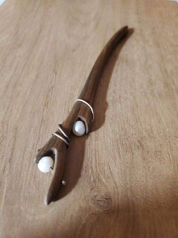 This wooden hair accessory is decorated with river pearls and 925 Sterling Silver wire.  This elegant hair accessory is a gorgeous gift.
