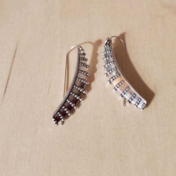 These 925 Sterling Silver  earrings are hand made and are hallmarked.  This range was influenced by an African shield.