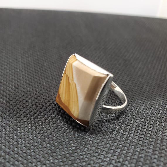 This gorgeous yellow Jasper is all hand made from stone cutting and polishing to manufacturing the 925 Sterling Silver ring.