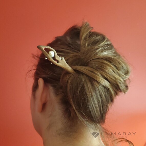 This wooden hair accessory is decorated with river pearls and 925 Sterling Silver wire.  This elegant hair accessory is a gorgeous gift.