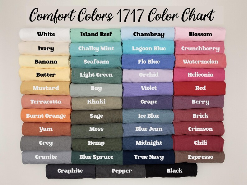 May include: A color chart titled "Comfort Colors 1717 Color Chart" displays a variety of fabric colors. The chart includes shades like white, ivory, banana, butter, mustard, terracotta, burnt orange, yam, grey, and granite.