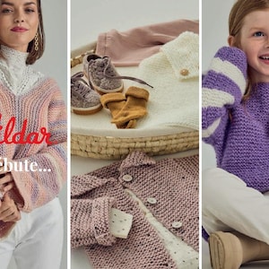May include: A multi-coloured striped knit jumper with a V-neck and long sleeves. The jumper is made of soft yarn and has a relaxed fit. The text "Pildar Je débute..." is printed on the jumper.