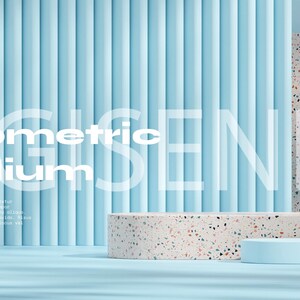 May include: A geometric podium with a light blue background. The podium is made of a light gray material with a speckled pattern. The text "Geometric Podium" is written in white letters on the blue background.