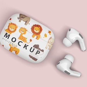 May include: White wireless earbuds with a charging case featuring a colorful cartoon animal print. The case has the word "MOCKUP" printed on it.