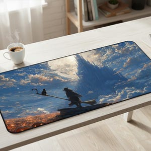May include: A rectangular desk mat featuring a fantasy illustration of a figure on a broomstick with a small creature, set against a backdrop of a towering castle in the clouds, a bright moon, and a glowing orange landscape at the bottom edge.