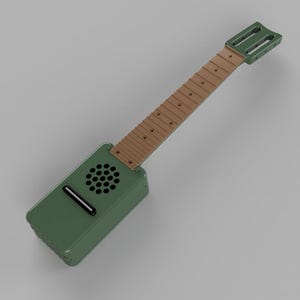 Puede incluir: Una guitarra de juguete verde y marrón con un agujero de sonido y un diapasón. La guitarra está hecha de plástico y tiene un diseño simple.