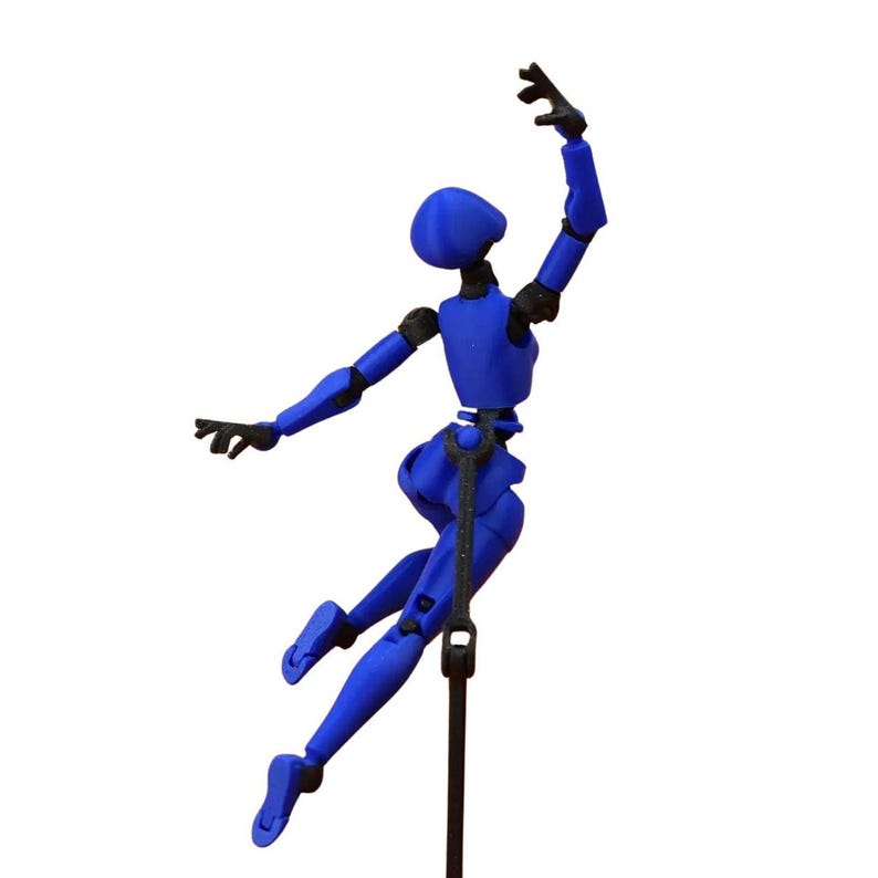 A blue and black articulated action figure posed mid-leap while attached to a black display stand.