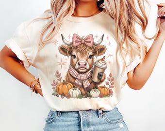 Fall Highland Cow PNG with Latte, Pumpkins, Pink Bow & Plaid Scarf – Cute Autumn Animal Clipart for Shirts, Sublimation and Farm Designs