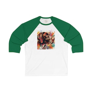 May include: A white and green baseball tee shirt with a colorful illustration of a German Shorthaired Pointer dog.