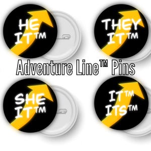 May include: Four black and yellow button pins with white text. The pins feature an arrow pointing upwards with the text "HE IT TM", "THEY IT TM", "SHE IT TM", and "IT TM ITS TM". The text "Adventure Line TM Pins" is printed below the pins.