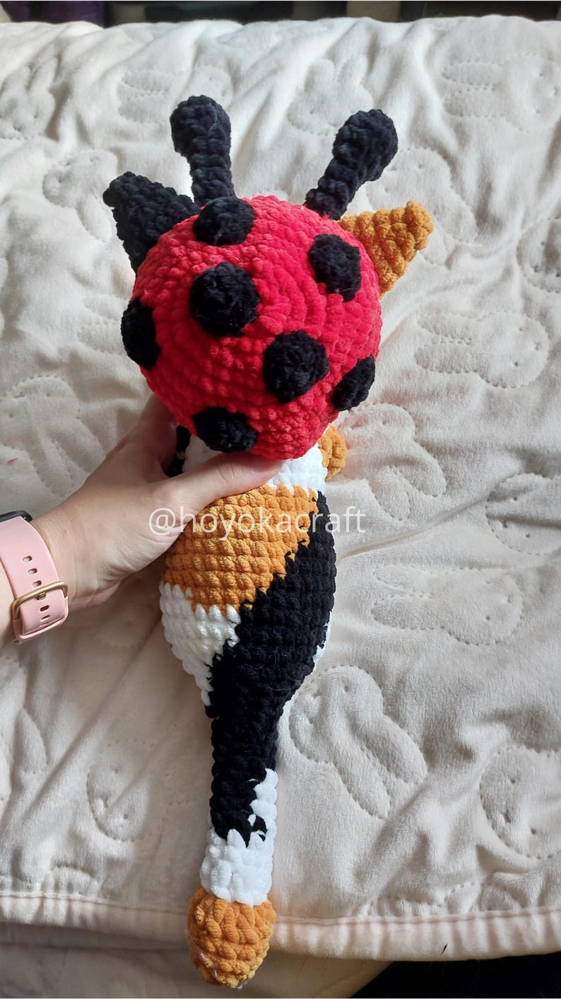 Calico cat crochet plush with ladybug hat