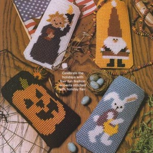 May include: Four different eyeglass cases with holiday themes. The cases are made of plastic canvas and feature a pumpkin, a snowman, a bunny rabbit, and a witch. The text "Celebrate the holidays with four fun fashion accents stitched with holiday flair." is printed on the image.